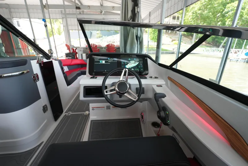 Slide: The Image of Interior of 2025 Regal LS9 boat with modern steering and dashboard. - 31