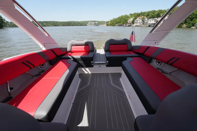 Slide: The Image of Luxurious 2025 Regal LS9 boat interior with red seating on a serene lake. - 37