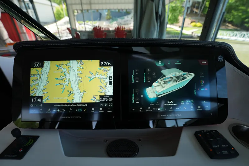 Slide: The Image of Dashboard of 2025 Regal LS9 boat with navigation and control screens. - 7