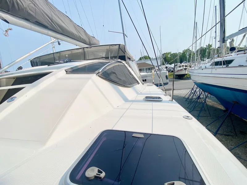 Slide: The Image of 2016 Celtic Yachts 40 sailboat on display at a marina, showcasing sleek design and craftsmanship. - 24