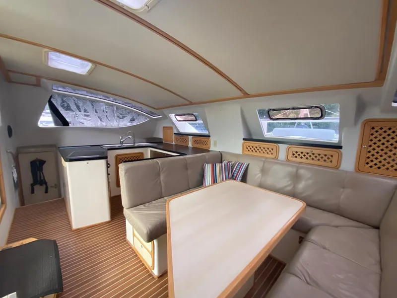Slide: The Image of Interior of 2016 Celtic Yachts 40, featuring a cozy seating area and modern kitchen. - 42