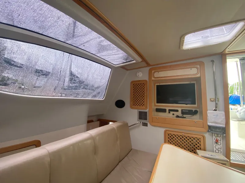 Slide: The Image of Interior of 2016 Celtic Yachts 40, featuring a cozy seating area and entertainment system. - 45