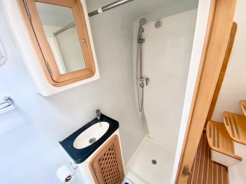 Slide: The Image of Compact bathroom in a 2016 Celtic Yachts 40, featuring a shower and sink. - 49