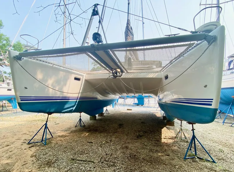 Slide: The Image of 2016 Celtic Yachts 40 catamaran on stands, showcasing sleek design and blue accents. - 8