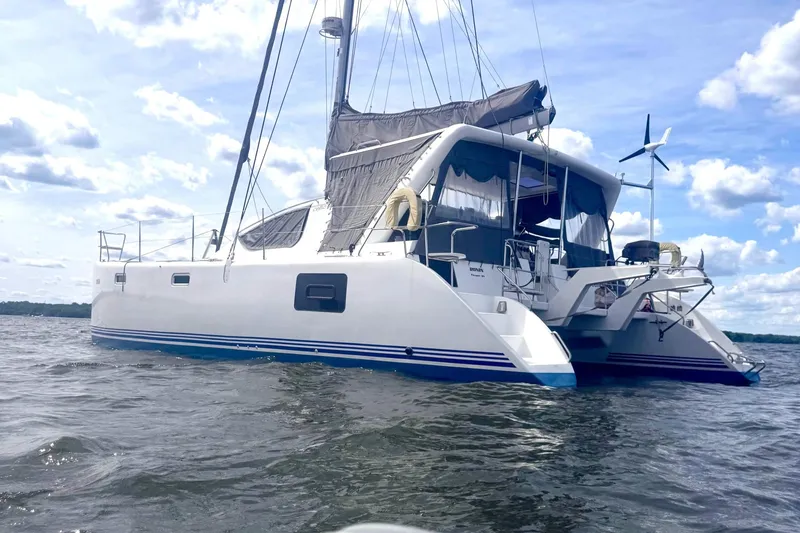 The Image of 2016 Celtic Yachts 40 catamaran sailing on a sunny day with blue skies. - 0