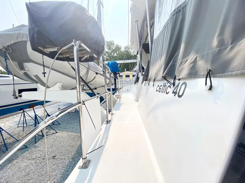 Slide: The Image of Celtic Yachts 40, 2016 model, docked with visible deck and railing. - 27
