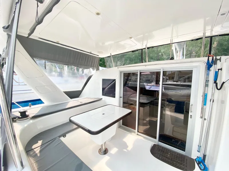Slide: The Image of 2016 Celtic Yachts 40 interior with sleek design, featuring a table and sliding glass doors. - 28