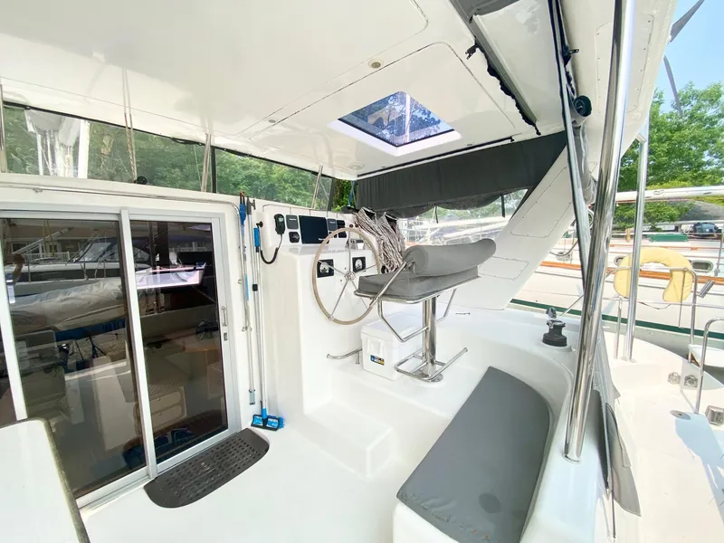 Slide: The Image of 2016 Celtic Yachts 40 cockpit with helm station, seating, and sliding glass door. - 29
