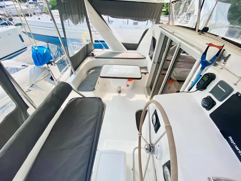 Slide: The Image of 2016 Celtic Yachts 40 cockpit with seating, table, and steering wheel. - 31
