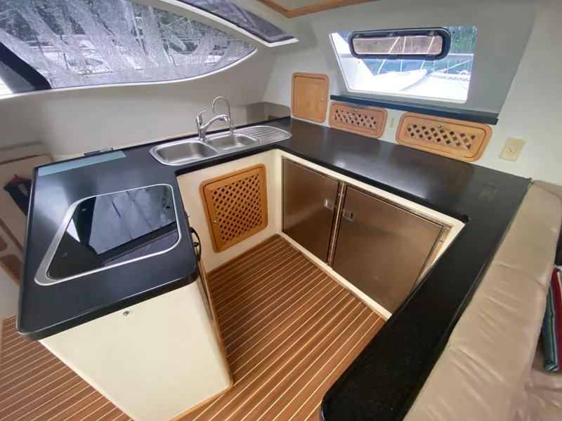 Slide: The Image of Modern kitchen in 2016 Celtic Yachts 40, featuring sleek countertops and stainless steel appliances. - 38