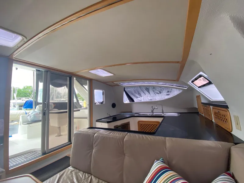 Slide: The Image of Interior of 2016 Celtic Yachts 40, featuring modern kitchen and comfortable seating area. - 44