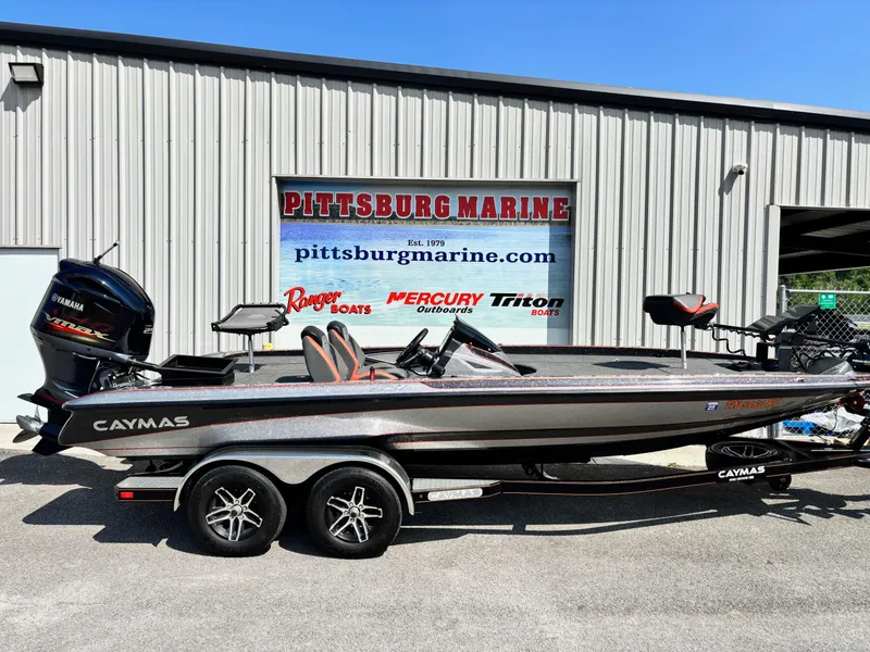 The Image of 2020 Caymas CX21 boat at Pittsburg Marine dealership, featuring dual axles and sleek design. - 0