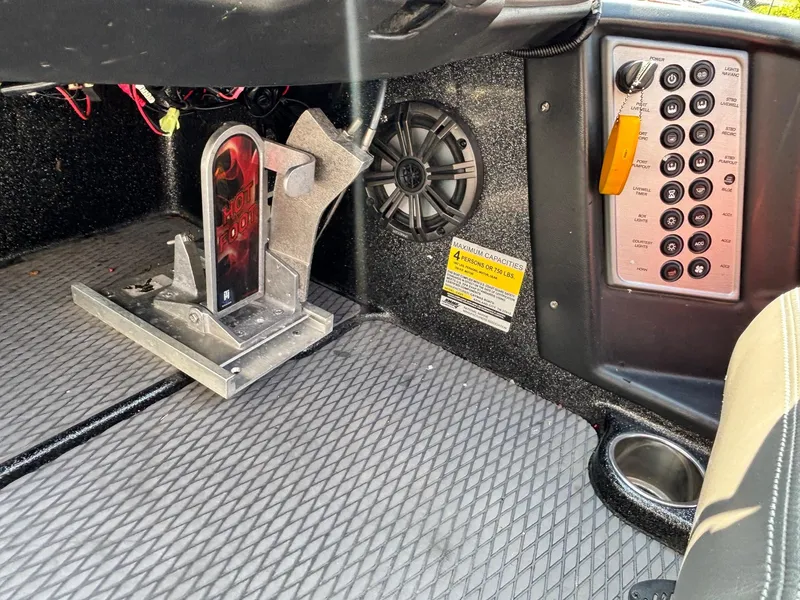 Slide: The Image of Interior of 2020 Caymas CX21 boat showing foot pedal, speaker, and control panel. - 10