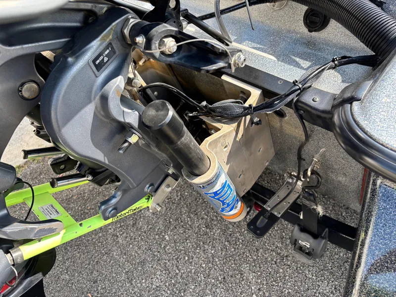 Slide: The Image of 2020 Caymas CX21 boat engine components and wiring on a textured surface. - 13