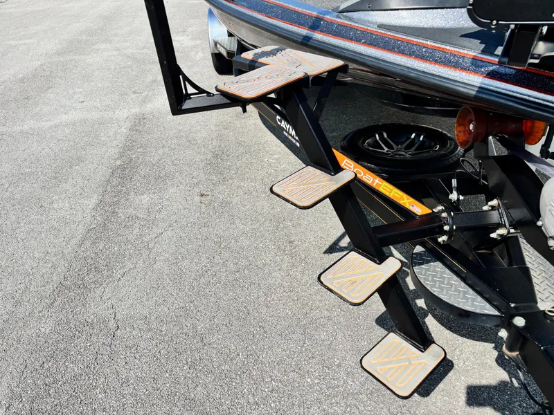 Slide: The Image of 2020 Caymas CX21 boat with retractable boarding ladder on trailer. - 2