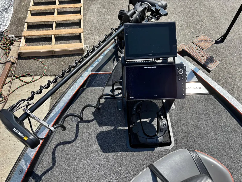 Slide: The Image of 2020 Caymas CX21 boat dashboard with electronic displays and trolling motor. - 4