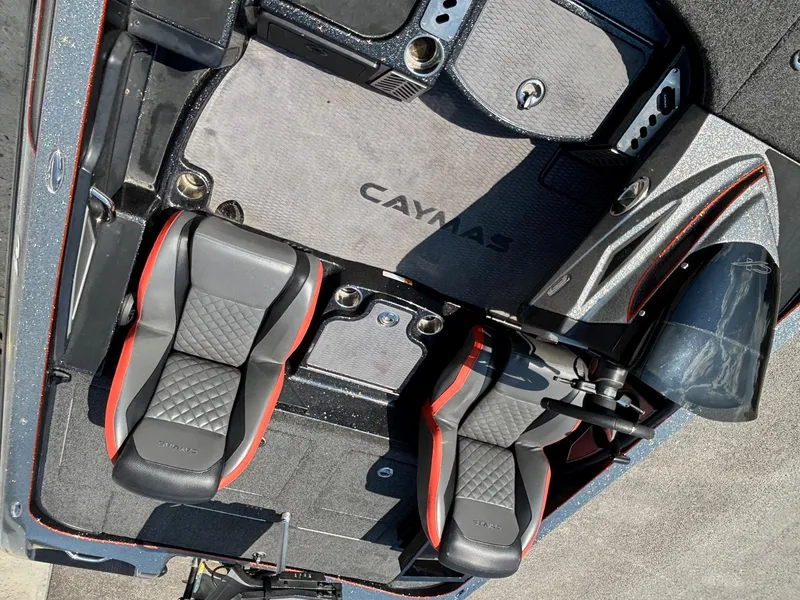 Slide: The Image of 2020 Caymas CX21 boat interior with dual seats and branded flooring. - 8