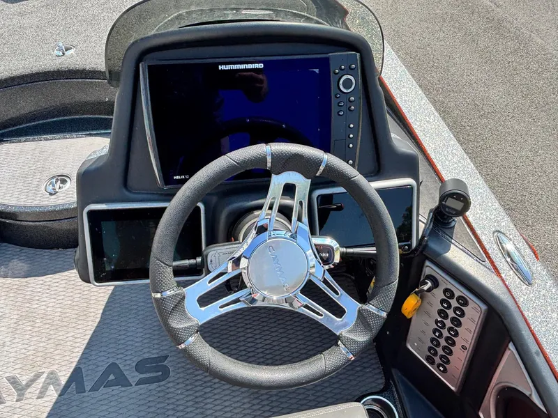 Slide: The Image of 2020 Caymas CX21 boat dashboard with steering wheel and Humminbird display. - 9