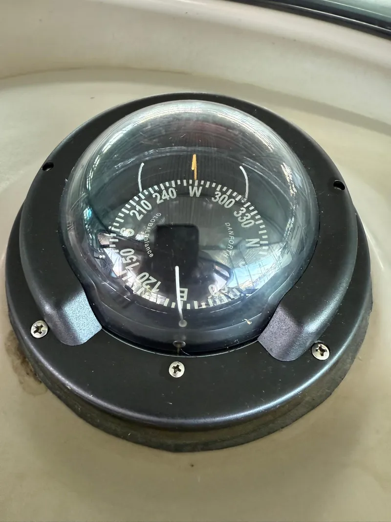 Slide: The Image of Compass on 2000 Maxum 3700 SCR boat, displaying navigational directions. - 15