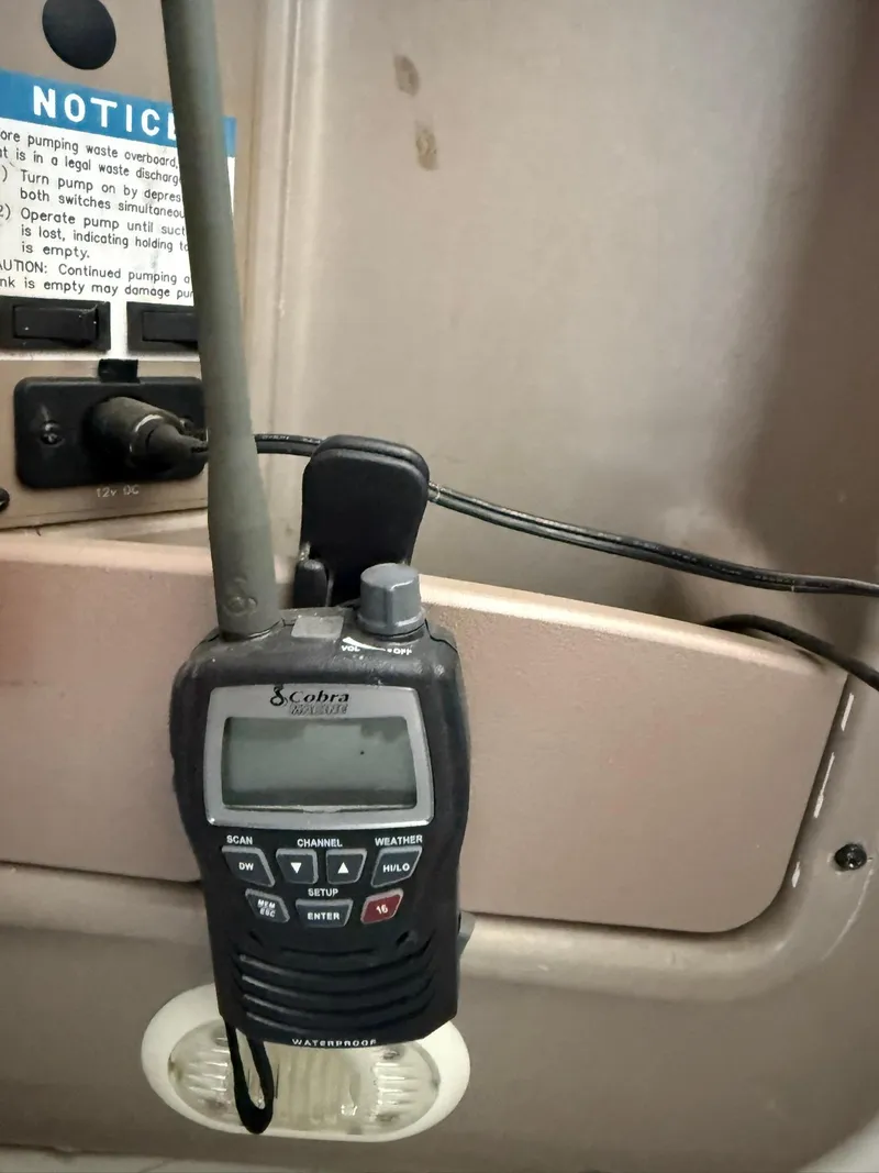 Slide: The Image of Cobra marine radio on a 2000 Maxum 3700 SCR boat dashboard. - 21