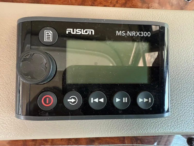 Slide: The Image of Fusion MS-NRX300 marine stereo controller on Maxum 3700 SCR yacht dashboard. - 26