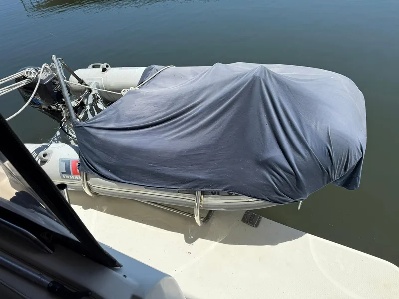 Slide: The Image of Covered inflatable boat docked beside a Maxum 3700 SCR, 2000 model. - 40