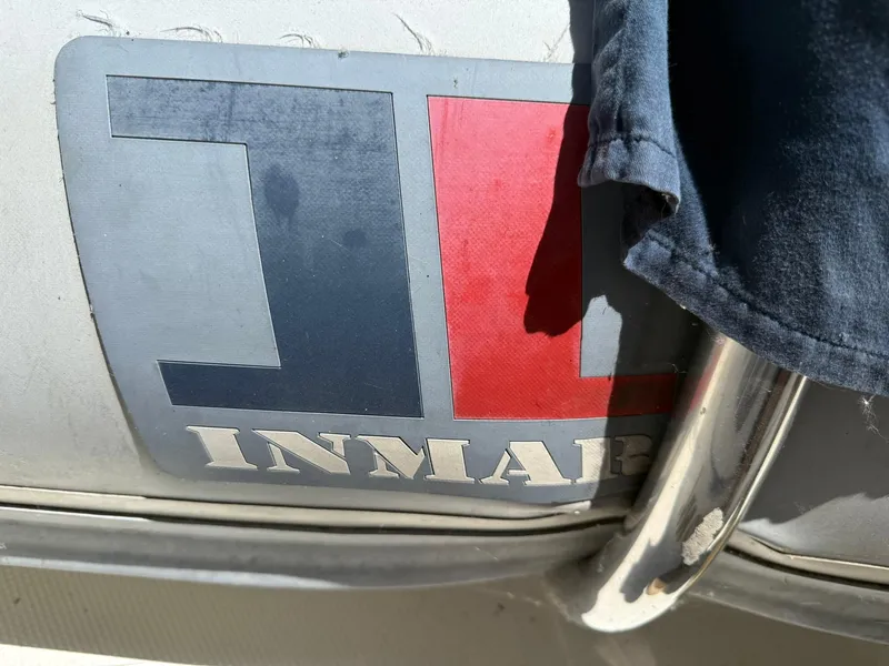 Slide: The Image of Logo on a Maxum 3700 SCR boat, year 2000, partially covered by fabric. - 41