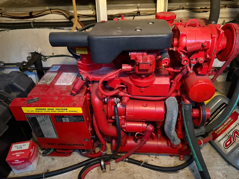 Slide: The Image of Red Westerbeke generator in a 2000 Maxum 3700 SCR boat engine room. - 43