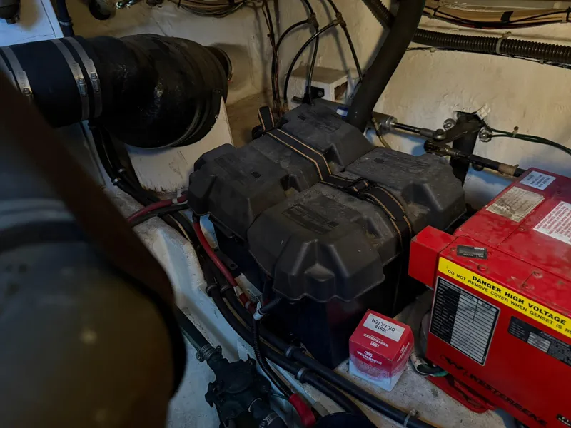 Slide: The Image of Engine compartment of 2000 Maxum 3700 SCR with batteries and generator. - 45