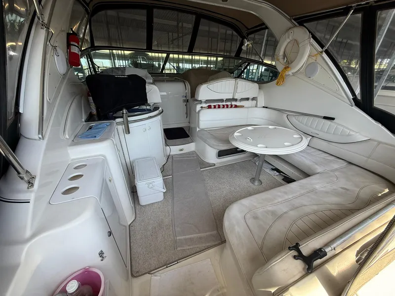 Slide: The Image of Interior of 2000 Maxum 3700 SCR yacht with seating and table. - 6