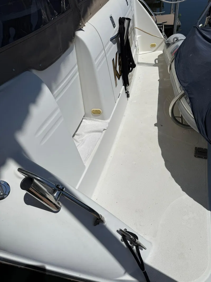 Slide: The Image of 2000 Maxum 3700 SCR boat deck with seating and railing. - 8