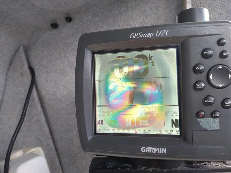 Slide: The Image of Garmin GPSmap 172C on Corsair F-24MKII, 2004 model, displaying colorful screen distortion. - 11