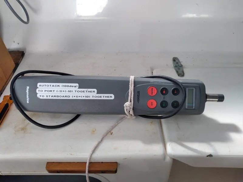 Slide: The Image of Autopilot control device on a 2004 Corsair F-24MKII sailboat, featuring navigation instructions. - 17