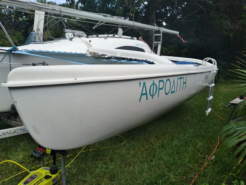 Slide: The Image of Corsair F-24MKII sailboat from 2004 named "ΑΦΡΟΔΙΤΗ" on grassy area. - 5