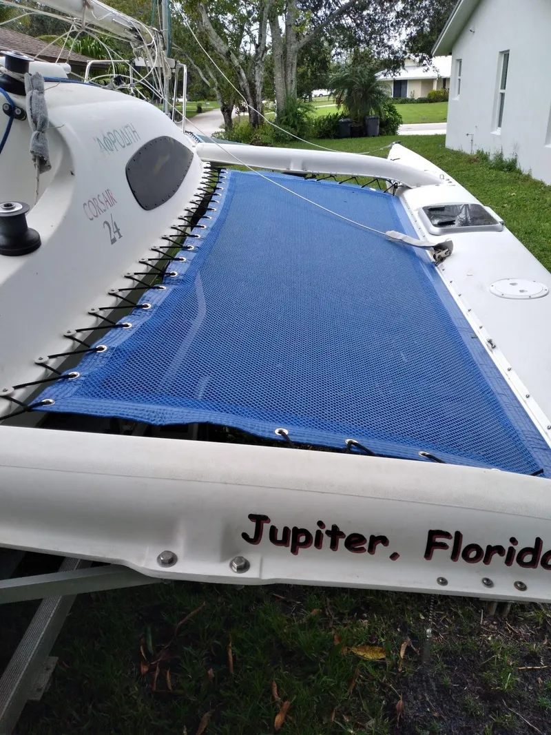 Slide: The Image of 2004 Corsair F-24MKII sailboat with blue netting, located in Jupiter, Florida. - 8