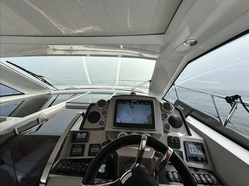 Slide: The Image of Cockpit view of 2018 Galeon 385 HTS yacht with navigation system and steering wheel. - 5