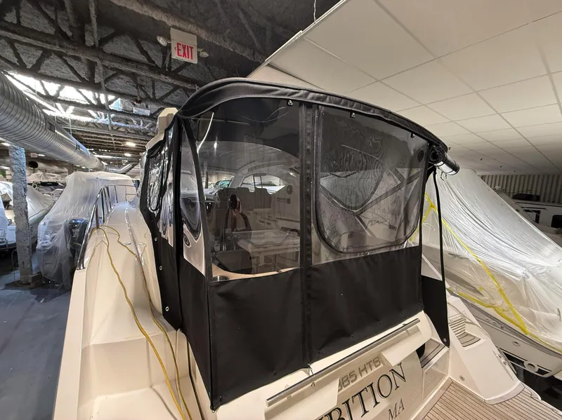 Slide: The Image of 2018 Galeon 385 HTS yacht with covered cockpit, docked indoors. - 7