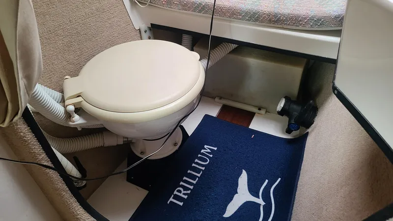 Slide: The Image of Compact marine toilet in a 1992 Corsair F-27 sailboat interior. - 9