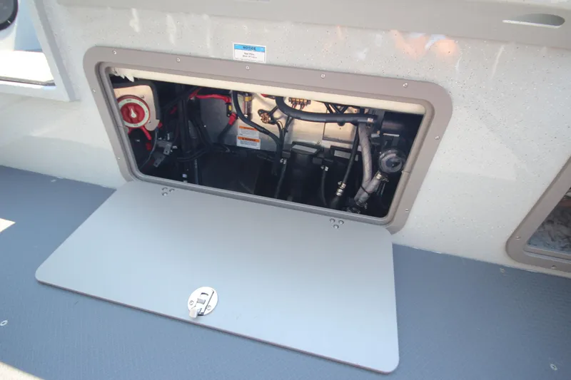Slide: The Image of Open hatch of 2026 Weldcraft 220 Ocean King F250 boat, showing internal components. - 12
