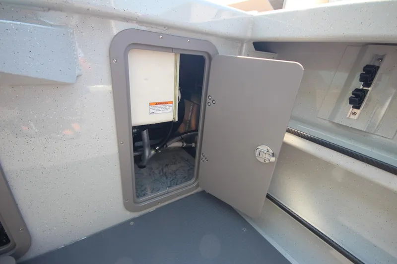 Slide: The Image of 2026 Weldcraft 220 Ocean King F250 boat compartment with open access panel. - 13
