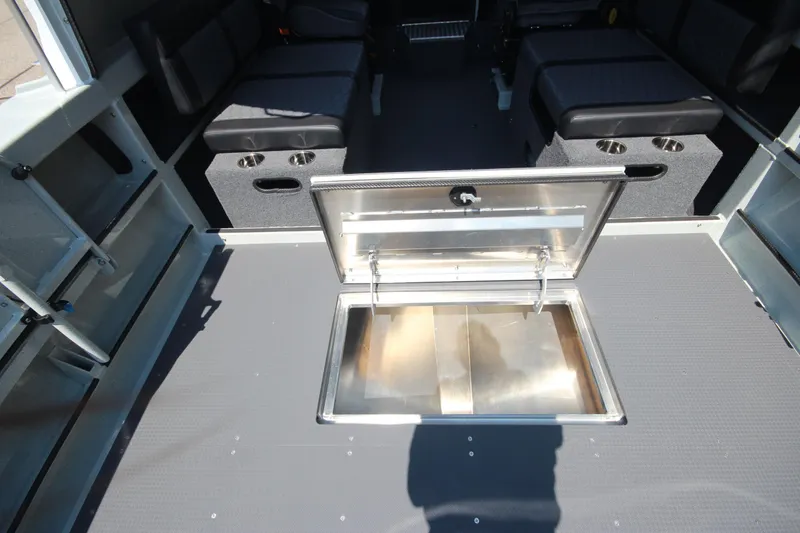 Slide: The Image of 2026 Weldcraft 220 Ocean King F250 interior with open storage compartment. - 14
