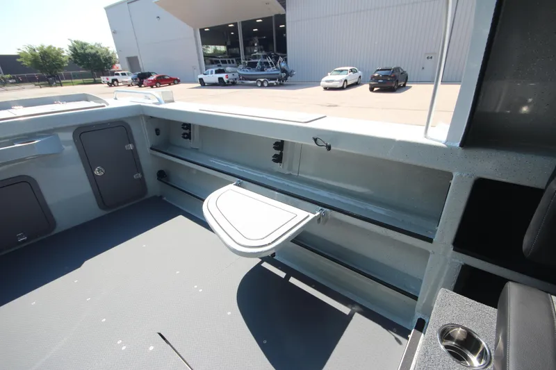 Slide: The Image of Interior of 2026 Weldcraft 220 Ocean King F250 boat, featuring storage compartments and seating. - 15