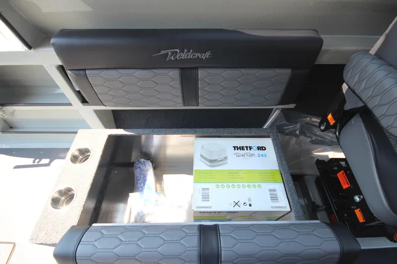 Slide: The Image of 2026 Weldcraft 220 Ocean King F250 interior with storage and Thetford Porta Potti 345. - 17
