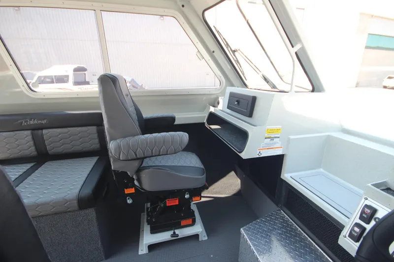 Slide: The Image of 2026 Weldcraft 220 Ocean King F250 boat interior with seating and control panel. - 19