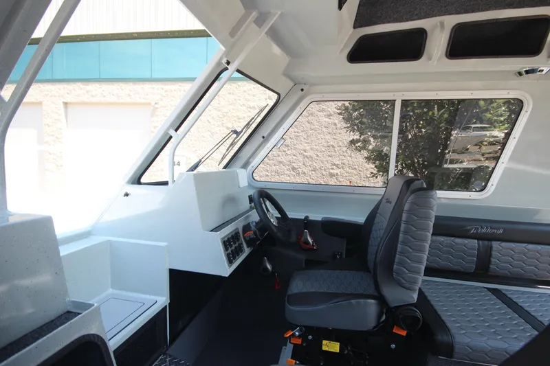Slide: The Image of Interior of 2026 Weldcraft 220 Ocean King F250 boat, featuring modern seating and controls. - 20