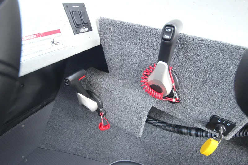 Slide: The Image of Interior controls of 2026 Weldcraft 220 Ocean King F250 boat, featuring throttle and switches. - 22