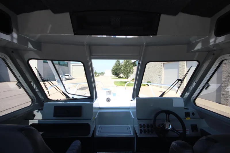 Slide: The Image of Interior view of 2026 Weldcraft 220 Ocean King F250 boat, showcasing helm and dashboard. - 25