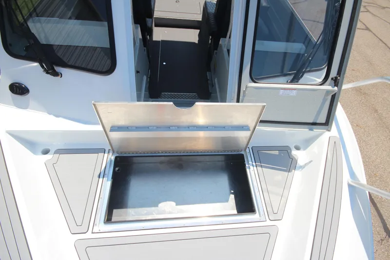 Slide: The Image of 2026 Weldcraft 220 Ocean King F250 boat with open storage compartment on deck. - 28