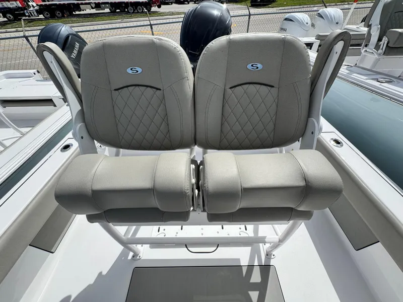 Slide: The Image of 2025 Sportsman Masters 247 Bay Boat with dual cushioned seats and sleek design. - 19