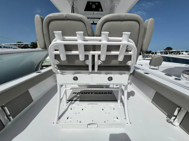 Slide: The Image of 2025 Sportsman Masters 247 Bay Boat interior with seating and rod holders. - 29